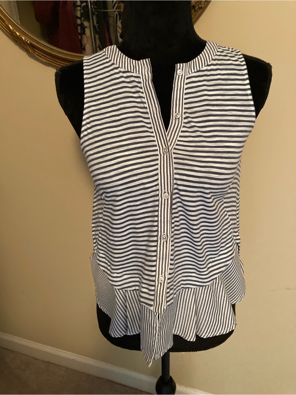 Striped Gray and White Sleeveless Button-Front Peplum Top from Anthropologie.